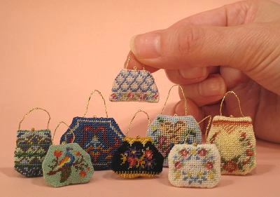Group of several dollhouse needlepoint hanbags
