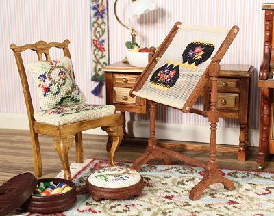 Corner of a dollhouse room showing a needlework stand in use