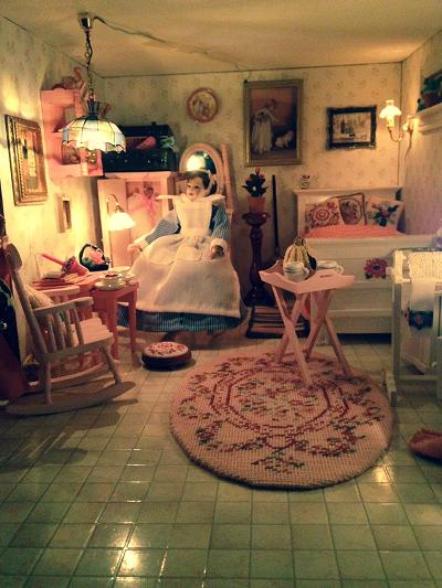 Dollhouse needlepoint carpet, footstool and cushion kits displayed in the servant's room