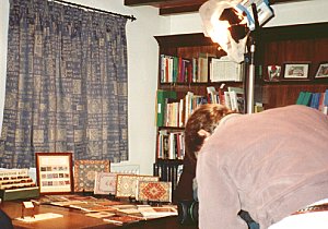 Cameraman filming Janet's miniature dollhouse carpets