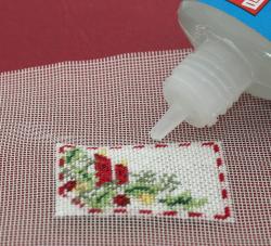 Miniature needlepoint tutorial - run a line of Fray Check around the edge of the stitching