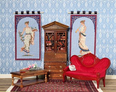 A room with wallhangings 'Grecian Lady' and 'Grecian Musician' in it