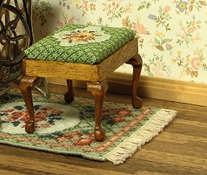 Rectangular stool on fringed carpet