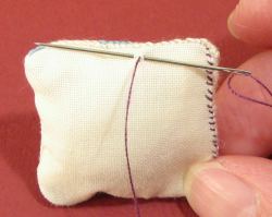 make two tiny backstitches close together