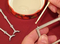 Dollhouse needlepoint tutorial - apply glue to the lugs