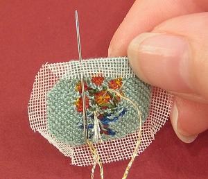 Miniature needlepoint tutorial - pass the needle up through the very edge of the seam allowance