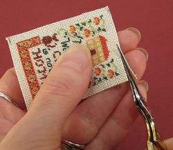 Dollhouse needlepoint tutorial - trim just one strand from the fabric