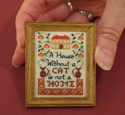 Dollhouse needlepoint tutorial - the finished sampler mounted in its frame